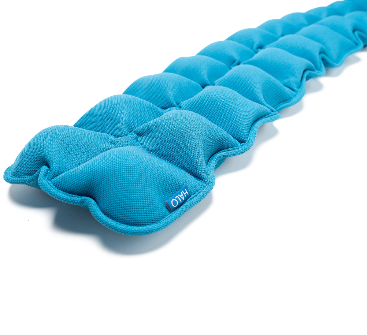 Halo Spine Stretcher. Blue weighted massage therapy heating pad with segmented, contoured sections on a white background.
